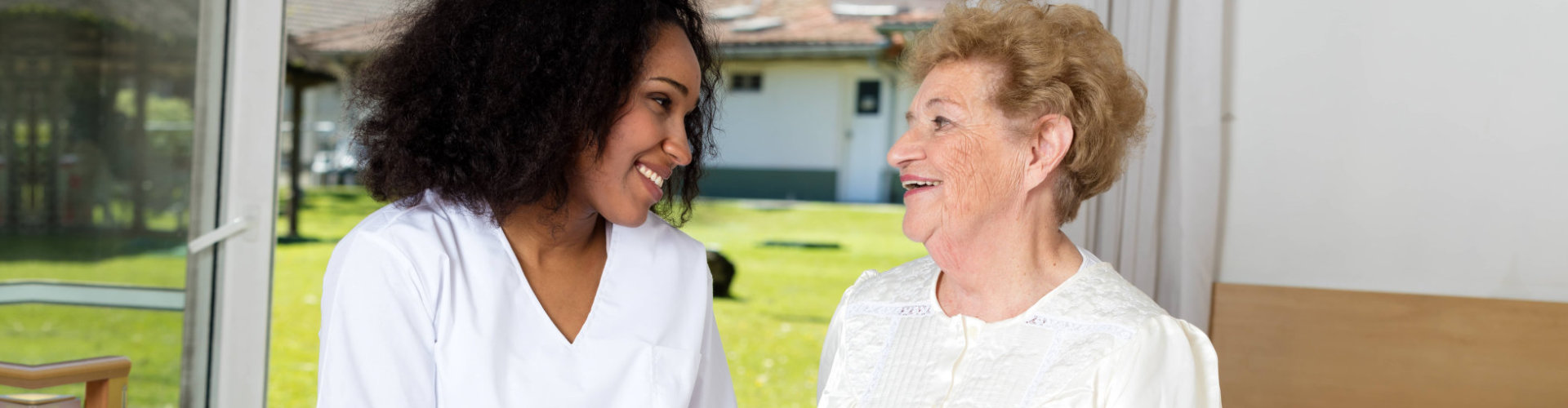 caretaker and her patient looking at each other